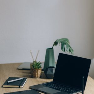 Free Black Laptop Computer On Brown Wooden Table Stock Photo